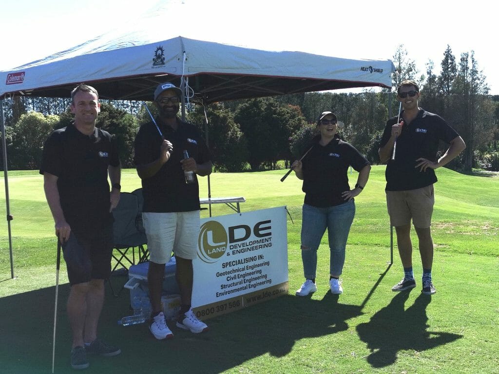 a group of people playing golf