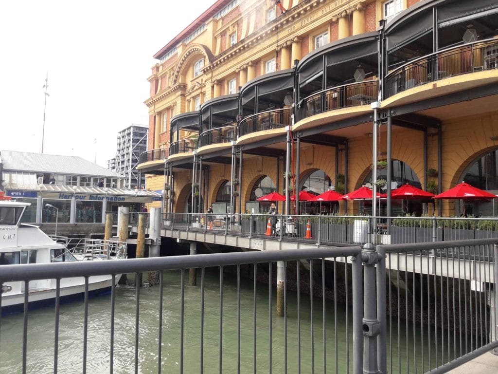 a building over water and a ferry