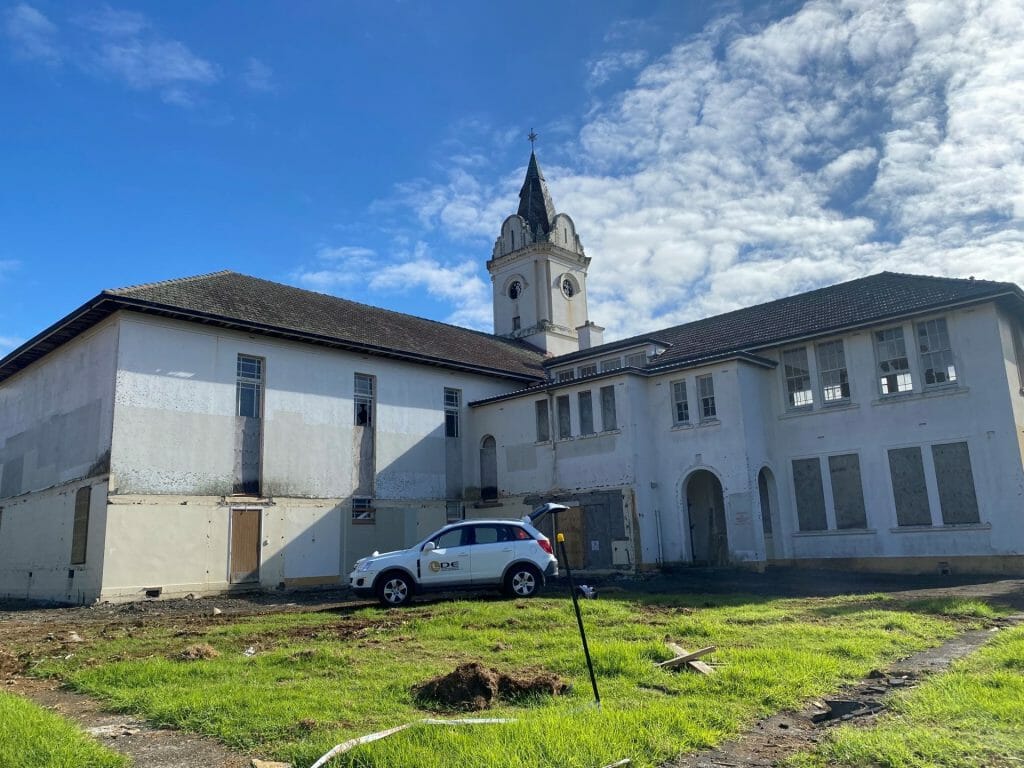 LDE vehicle in front of an old building